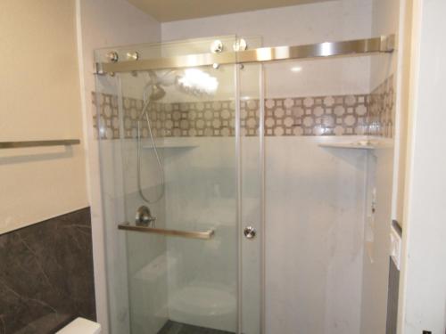 a shower with a glass door in a bathroom at STR25-15 Home 3 Bedrooms 2 Bath in Marina