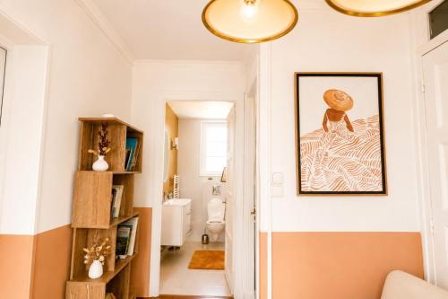 a hallway with a bathroom with a painting on the wall at Gite à la campagne 4 étoiles - 200m2 in Sailly