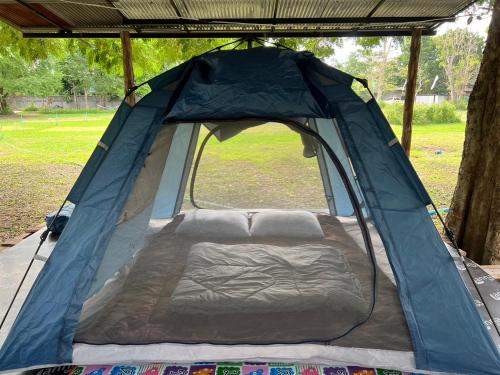 a tent is set up in a park at เป้แคมป์ปิ้งเขาใหญ่ in Ban Khanong Phra Tai