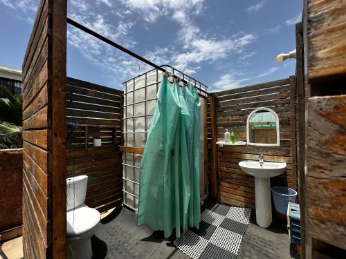 a bathroom with a toilet and a sink at Villa malaka in Dakar