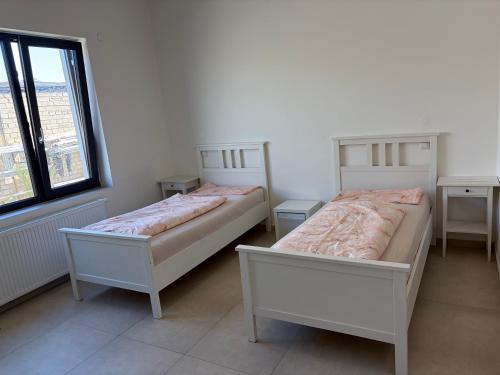 a bedroom with two beds and a window at Private Room in Hannover