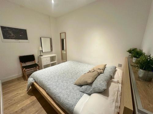a bedroom with a bed with pillows on it at CasaGerman in Sierra Nevada