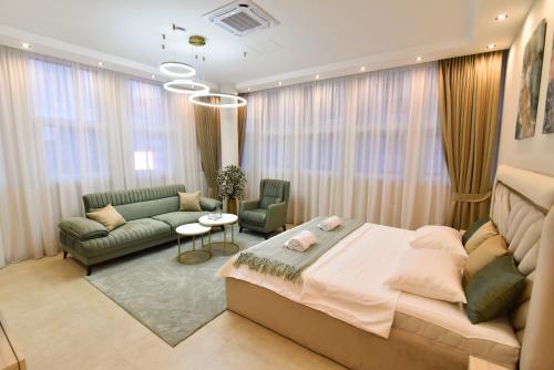 a bedroom with a bed and a living room at Dream Palace 2 in Belgrade
