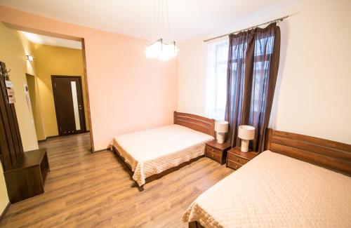 Ένα ή περισσότερα κρεβάτια σε δωμάτιο στο Aparthotel Na Mytniy