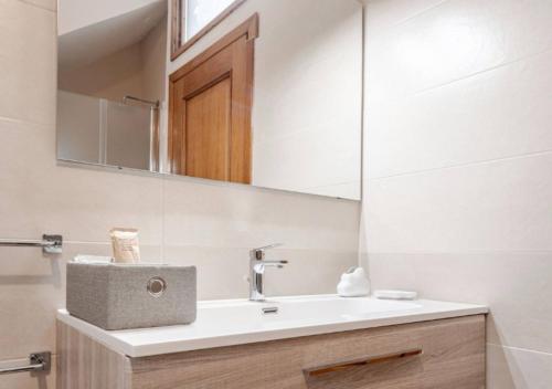 a bathroom with a sink and a mirror at Civico4 - Osteria Varanalle in Ariano Irpino