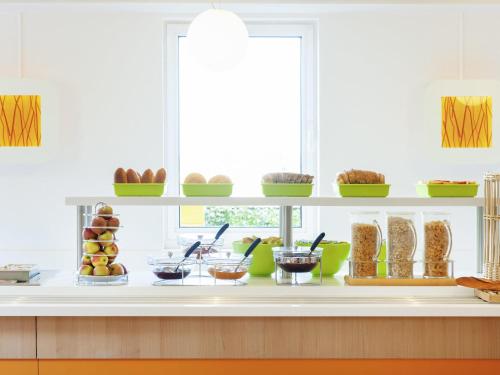 a display of food on a counter in a kitchen at ibis budget Hotel Brussels Airport in Diegem