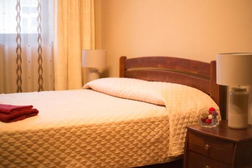 Ένα ή περισσότερα κρεβάτια σε δωμάτιο στο Aparthotel Na Mytniy