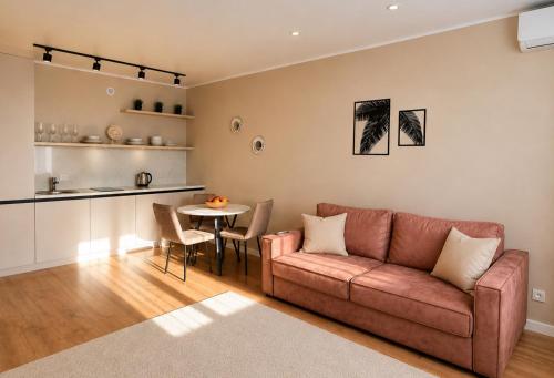 a living room with a couch and a table at Ауельбекова 120 in Kokshetau