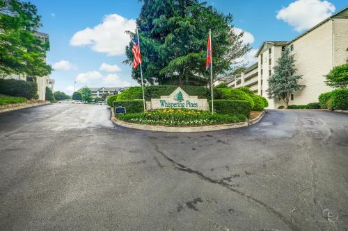 a street with a sign in the middle of a road at Rock-a-While Whispering Pines 214 in Pigeon Forge
