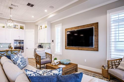 a living room with a couch and a tv at The Sanctuary in Padre Island