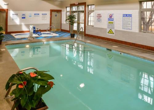 a swimming pool with blue water in a building at Artist Road #7 in Santa Fe