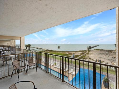 a balcony with a view of the ocean at Laguna Reef #311 - Heavenly Hill in Rockport