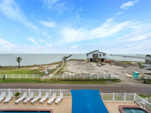 a view of the ocean from the balcony of a beach house at Laguna Reef #311 - Heavenly Hill in Rockport