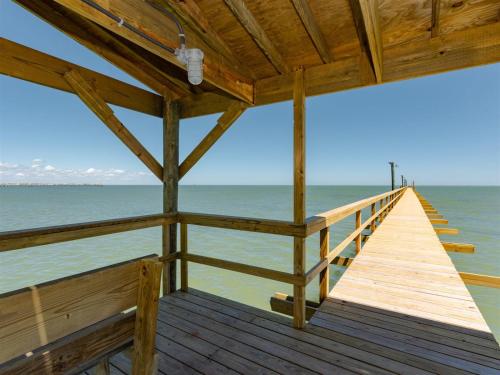 a wooden dock with the ocean in the background at Laguna Reef #208 - Sea Happiness in Rockport