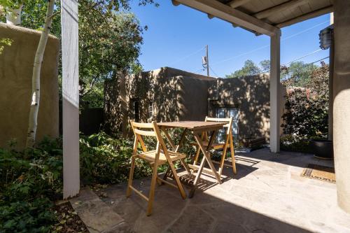a table and two chairs on a patio at Fiddlers Retreat in Santa Fe