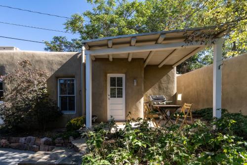 a small house with an awning over a patio at Fiddlers Retreat in Santa Fe