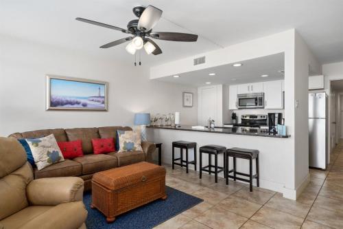 a living room with a couch and a kitchen at Laguna Reef #315 - Bayview Retreat in Rockport