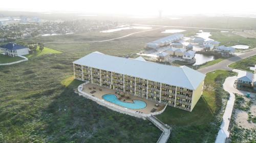 an aerial view of a resort building with a pool at Shore Thang in Port Aransas