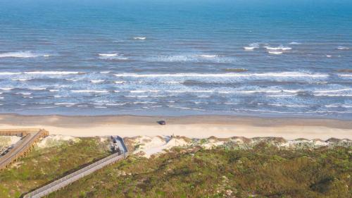 an aerial view of a beach and the ocean at Shore Thang in Port Aransas
