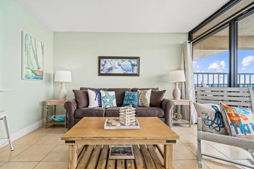 a living room with a couch and a table at Laguna Reef #308 - Beautiful Bay View in Rockport