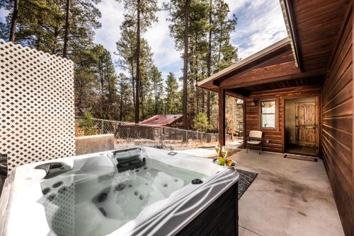 a jacuzzi tub on the patio of a house at The Great Escape in Ruidoso