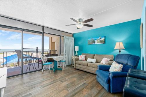a living room with a couch and a table at Laguna Reef #211 - Rod and Reel in Rockport