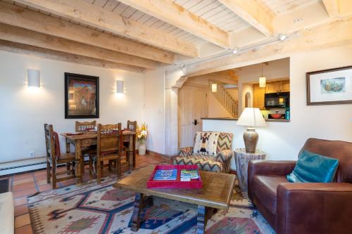 a living room with a couch and a table at Las Brisas 24 in Santa Fe