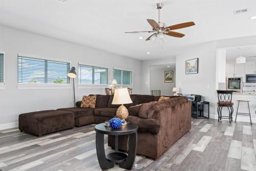 a living room with a couch and a table at Edgewater Escape in Rockport