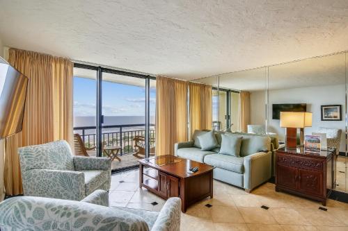 a living room with a couch and a table at San Luis 935-Luis Lookout in Galveston