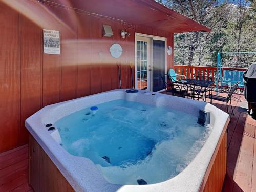 a jacuzzi tub in a house with a patio at Touch of Santa Fe in Ruidoso