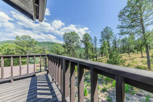 a deck with a view of the mountains at Castle House in Ruidoso