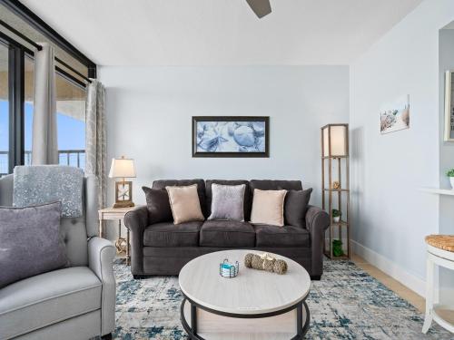 a living room with a couch and a table at LR 309 - Ms, Annies Oasis in Rockport