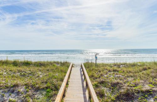 a wooden boardwalk leading to the beach at Jacksonville Beachdrifter 202 - Beach View in Jacksonville Beach