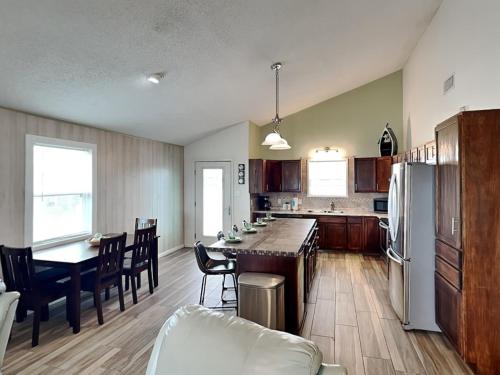 a kitchen and dining room with a table and chairs at Seagulls Landing in Galveston