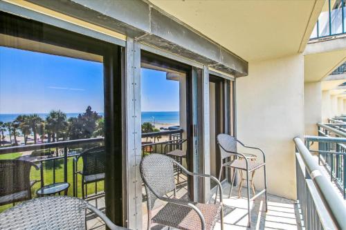 a balcony with chairs and a view of the ocean at San Luis Resort 533 - Luis Laid Back in Galveston