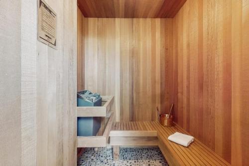 a bathroom with a shower with a bench in it at Whidbey Mariners’ Retreat in Oak Harbor