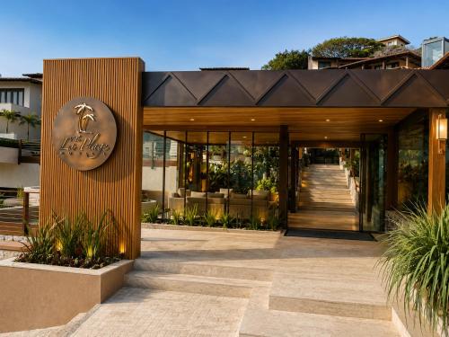 a building with a sign on the front of it at HOTEL VILLE LA PLAGE & BEACH CLUB in Búzios