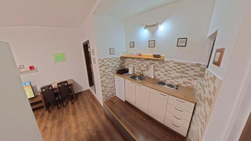 a kitchen with a sink and a counter top at STUDIO 88 red in Ohrid
