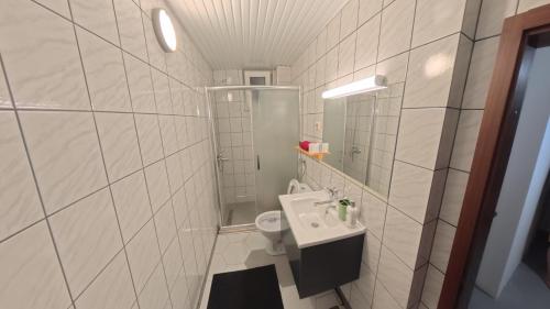 a small bathroom with a sink and a toilet at STUDIO 88 red in Ohrid