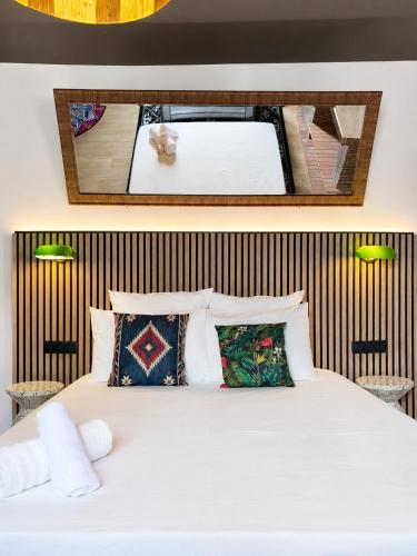 a bedroom with a large white bed with pillows at CentralStay Tours Centre Gare - Ouverture Aout '26 in Tours