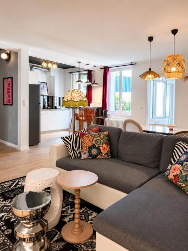 a living room with a couch and a table at CentralStay Tours Centre Gare - Ouverture Aout '26 in Tours