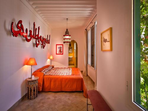 Llit o llits en una habitació de Riad Oasis 3