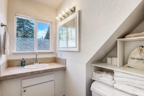 a bathroom with a sink and a window at Panorama Chalet in Nebelhorn