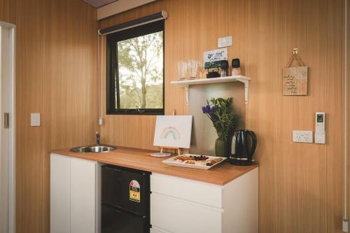 a kitchen with a counter with a sink and a sink at Three-Kalm & Four-Sol by Tiny Away in Rainbow Flat