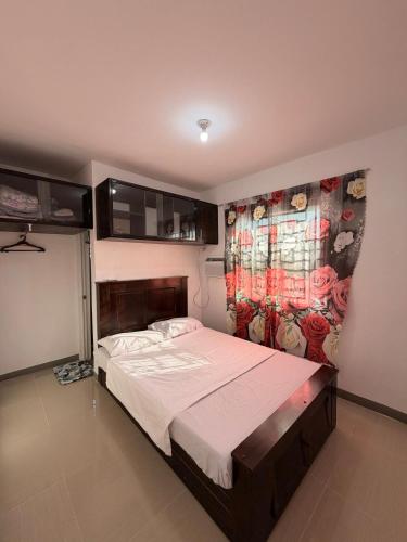 a bedroom with a large bed in a room at Casa Saturnino Private Staycation 