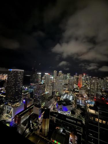 a view of a city at night at Miami Luxe Sky 27 Skyline View Stunning Water & City Lights View, Resort Pool,Gym,Spa Restaurants in Miami