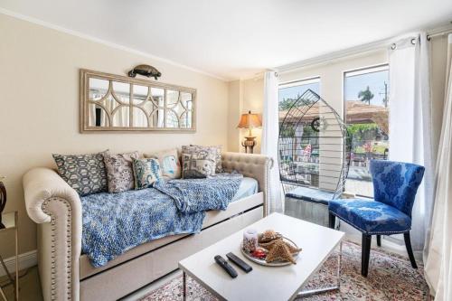 a living room with a couch and a table at Luxury Waterfront Villa, With Private Hot Tub, Beachs, Aventura Mall Casinos, Restaruants in Hallandale Beach
