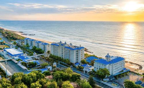 an aerial view of a resort on the beach at Lan Rung Beach Resort in Long Hai