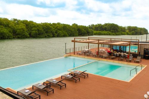 a swimming pool on the deck of a boat at Grand Resort & Residences in Belize City