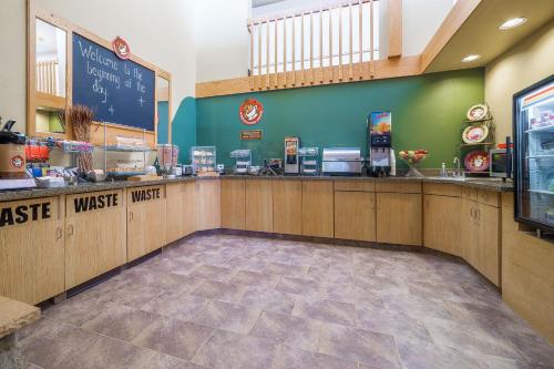 a fast food restaurant with a cash register and a counter at AmericInn by Wyndham Sioux Falls in Sioux Falls